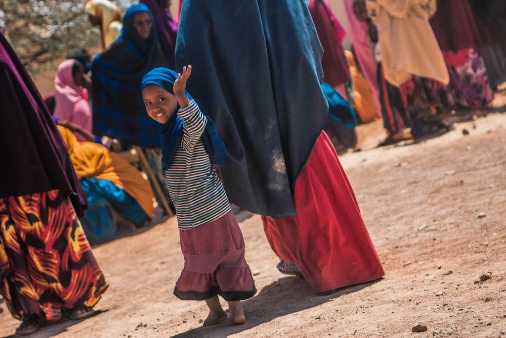 Beneficiary-Waving-at-Camera-Follow-Your-Donation