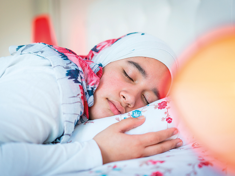 Muslim woman in hijab sleeping in on Eid - eid personality