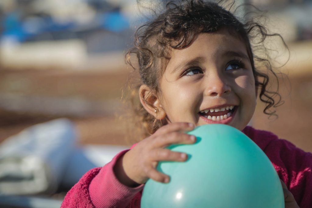 Orphan girl with balloon