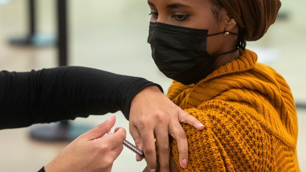 Canadian Muslim Woman Getting Vaccine